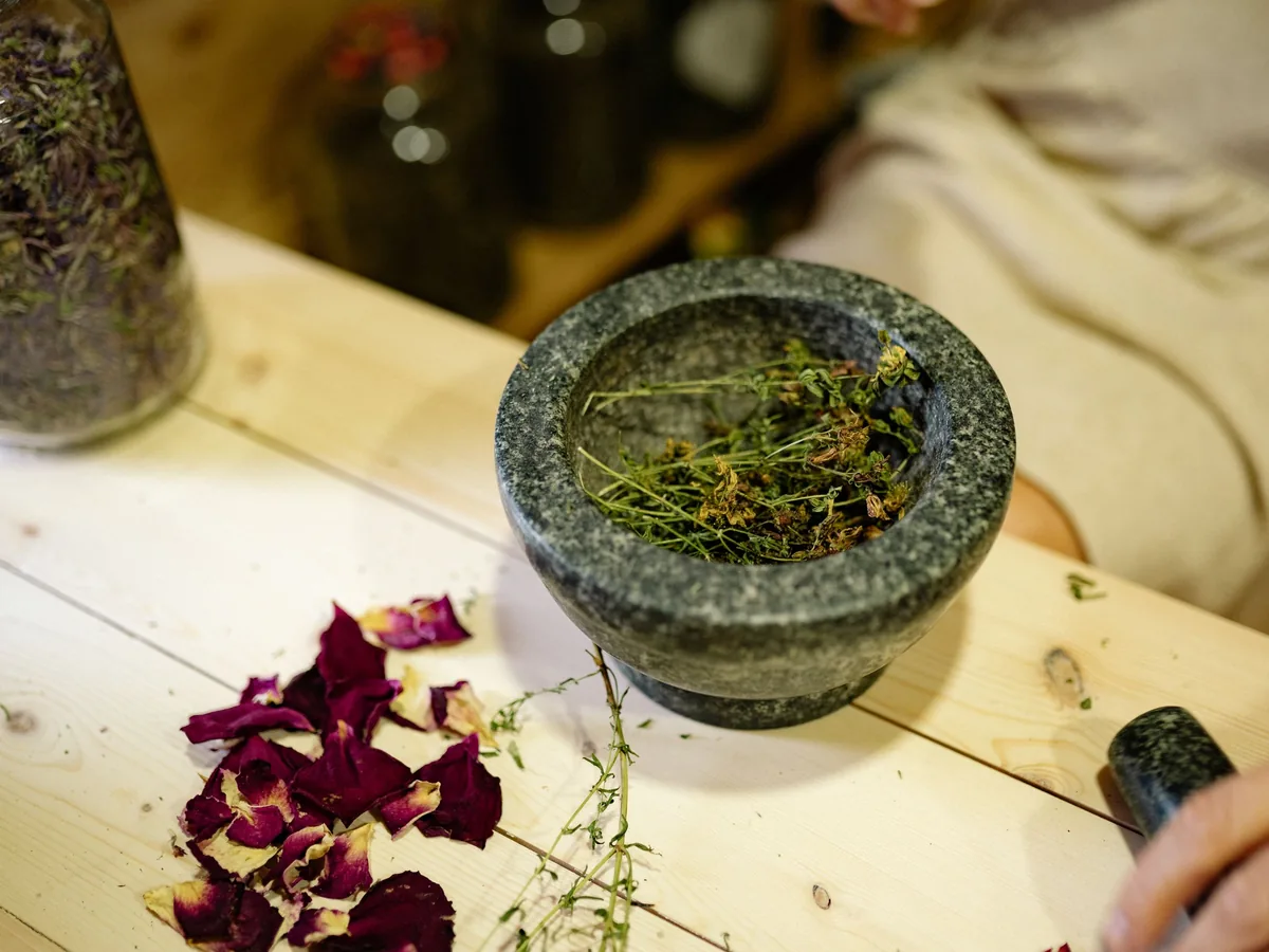 Dried herbs in a mortar and pestle